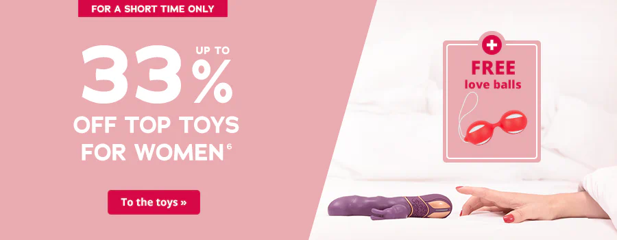 Two-part advertisement. There is a pink background on one side with white text that says: “Up to 33% off the top toys for women”. There is a picture of a woman's hand reaching for a purple rabbit vibrator on a bed on the other side of the advertisement. There is also a pink eye-catcher with the words “+ FREE love balls” in red letters. A picture of some love balls are shown underneath the text. There is a short element at the top of the advertisement that has a red background and the words “For a short time only”. There is a call-to-action button at the bottom with a red background and the words “To the toys »”.